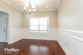 Clarksville house for rent - a dining room with white walls and a window