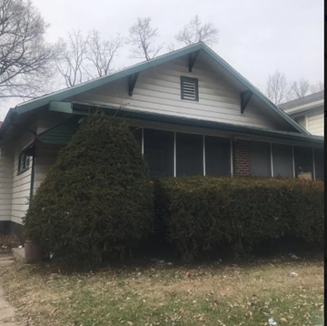 Indianapolis house for rent - a house with hedges in front of it