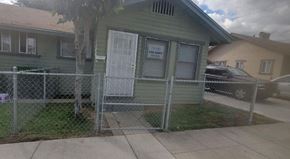 Ontario apartment for rent - a green house with a fence in front of it