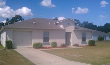 St. Marys apartment for rent - a white house with a driveway and a garage door
