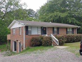 Bessemer house for rent - a small brick house with a porch and stairs