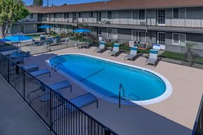 Norwalk apartment for rent - a large swimming pool in front of a hotel building