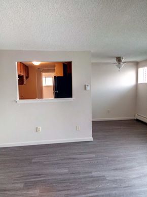 Broomfield apartment for rent - an empty living room with white walls and a window
