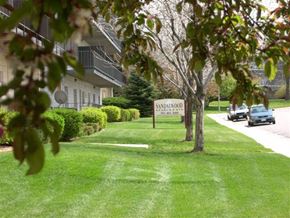 Broomfield apartment for rent - two cars parked in front of an apartment building