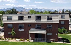 Broomfield apartment for rent - an apartment building with mountains in the background
