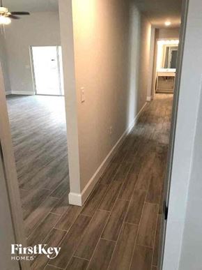 Fort Myers house for rent - a hallway with wood flooring in a house