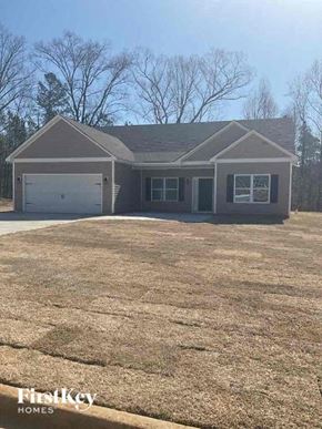 Dallas house for rent - a house with a large yard and a garage