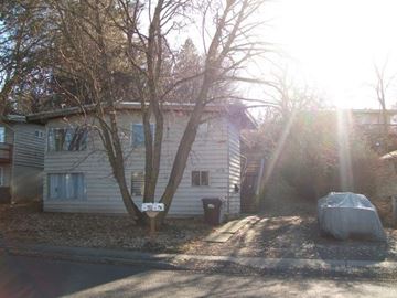 Pullman apartment for rent - A house with a car parked in front of it.
