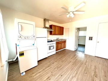 Santa Cruz apartment for rent - a kitchen with white appliances and a wooden floor