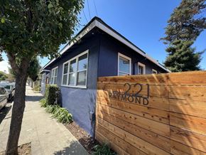 Santa Cruz apartment for rent - a wooden fence in front of a blue house