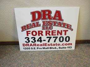 Pullman apartment for rent - A sign for DRA Real Estate LLC is displayed on a carpeted floor.