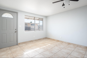 El Cajon apartment for rent - Empty room with tiled floor and sliding glass door.