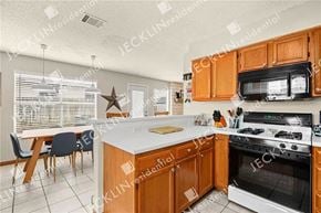 Pflugerville house for rent - A kitchen with wooden cabinets and a white countertop.