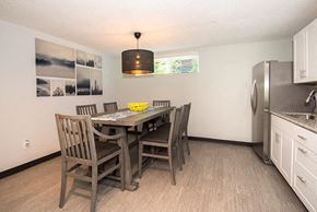 Portland apartment for rent - a kitchen with a table and chairs and a refrigerator