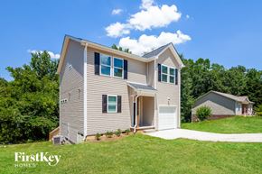 Gastonia house for rent - a with a lawn and a driveway