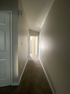 Louisville house for rent - A hallway with a white door on the left and a light at the end.