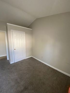 Louisville house for rent - A room with a white door and carpeted floor.