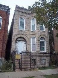 Chicago apartment for rent - A brick building with a white door and windows.