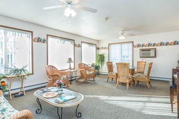 Fargo townhouse for rent - a living room with a dining room table and chairs