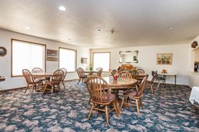 Fargo townhouse for rent - a conference room with a round table and chairs