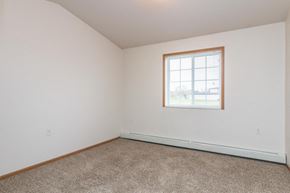 West Fargo apartment for rent - an empty room with a window and carpet