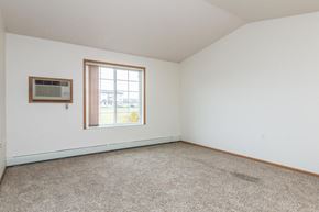 West Fargo apartment for rent - an empty room with a window and carpet