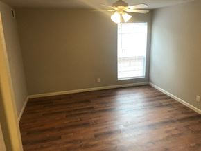 St. Louis apartment for rent - a empty living room with wood floors and a window