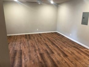 St. Louis apartment for rent - a empty room with wooden floors and white walls