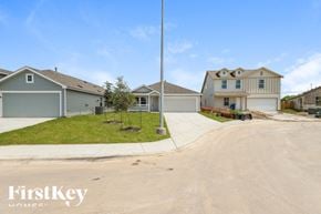 San Antonio house for rent - A residential area with houses and a clear sky.