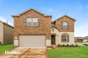 Hockley house for rent - A brick house with a garage door and a window.