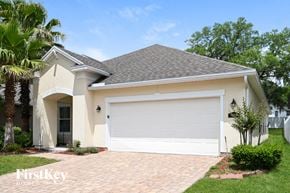 Jacksonville house for rent - A house with a white garage door and a brick driveway.