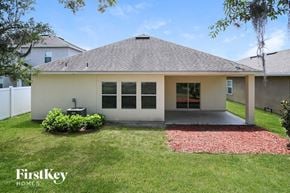 Jacksonville house for rent - A house with a red brick walkway in front of it.