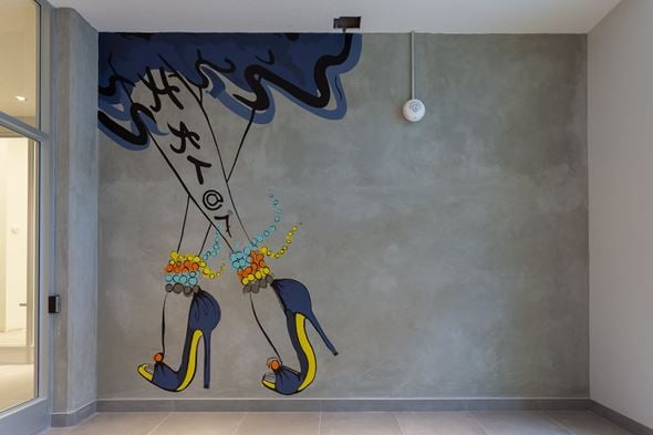 Calgary apartment for rent - A wall mural of high heel shoes with flowers on them.