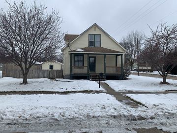 Fremont apartment for rent - A house with a snow-covered ground in front of it.
