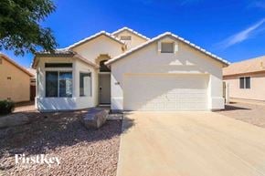 Mesa house for rent - a white house with a white garage door