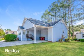 Pinson house for rent - A white house with a porch and a covered entrance.