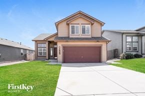 Colorado Springs house for rent - a house with a driveway and a garage door