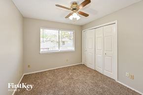 Spring house for rent - the master bedroom has a ceiling fan and a closet