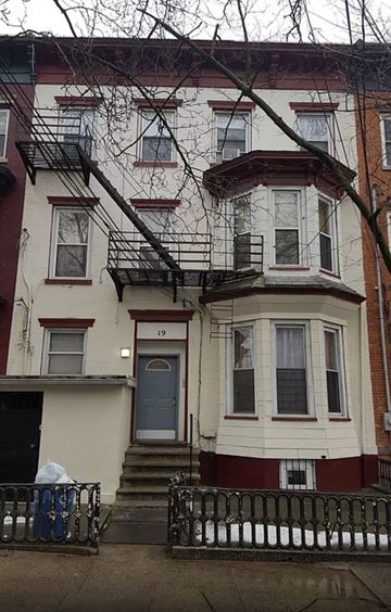 Jersey City apartment for rent - the front of a house with a fire escape