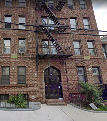 Brooklyn apartment for rent - the front of a brick building with a fire escape