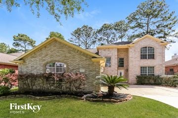 Humble house for rent - a brick house with a palm tree in the yard
