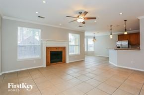 Humble house for rent - an empty living room with a fireplace and a kitchen