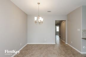 Baytown house for rent - the living room and dining room with the hallway in the background