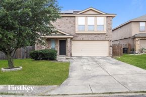 San Antonio house for rent - a white brick house with a sidewalk in front of it
