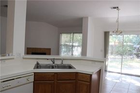 Cedar Park house for rent - an empty kitchen with a sink and a window
