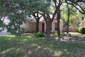 Cedar Park house for rent - a small white house with trees in front of it
