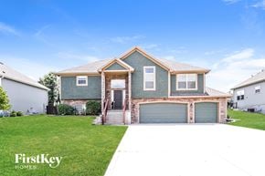 Basehor house for rent - A house with a garage door is for sale.