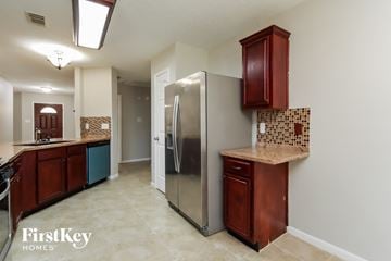 League City house for rent - a kitchen with a stainless steel refrigerator and a counter top