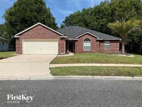 Middleburg house for rent - a brick house with a white garage door