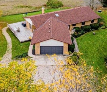 Guelph house for rent - A house with a red tiled roof and a garage.